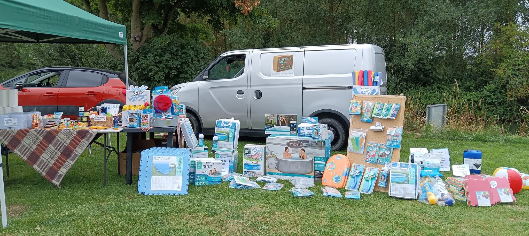 Chemical Box van with pool and hot tub products displayed outside